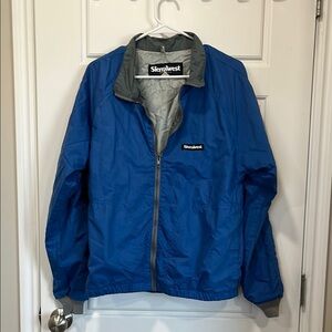 Blue Windbreaker with Elastic Cuffs and Gray Lining